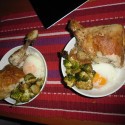 confit crispy chicken legs with an slow poached egg, rice and deep fried brussel sprouts 