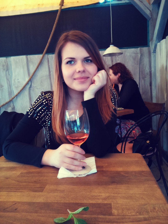 enjoying a glass of wine.